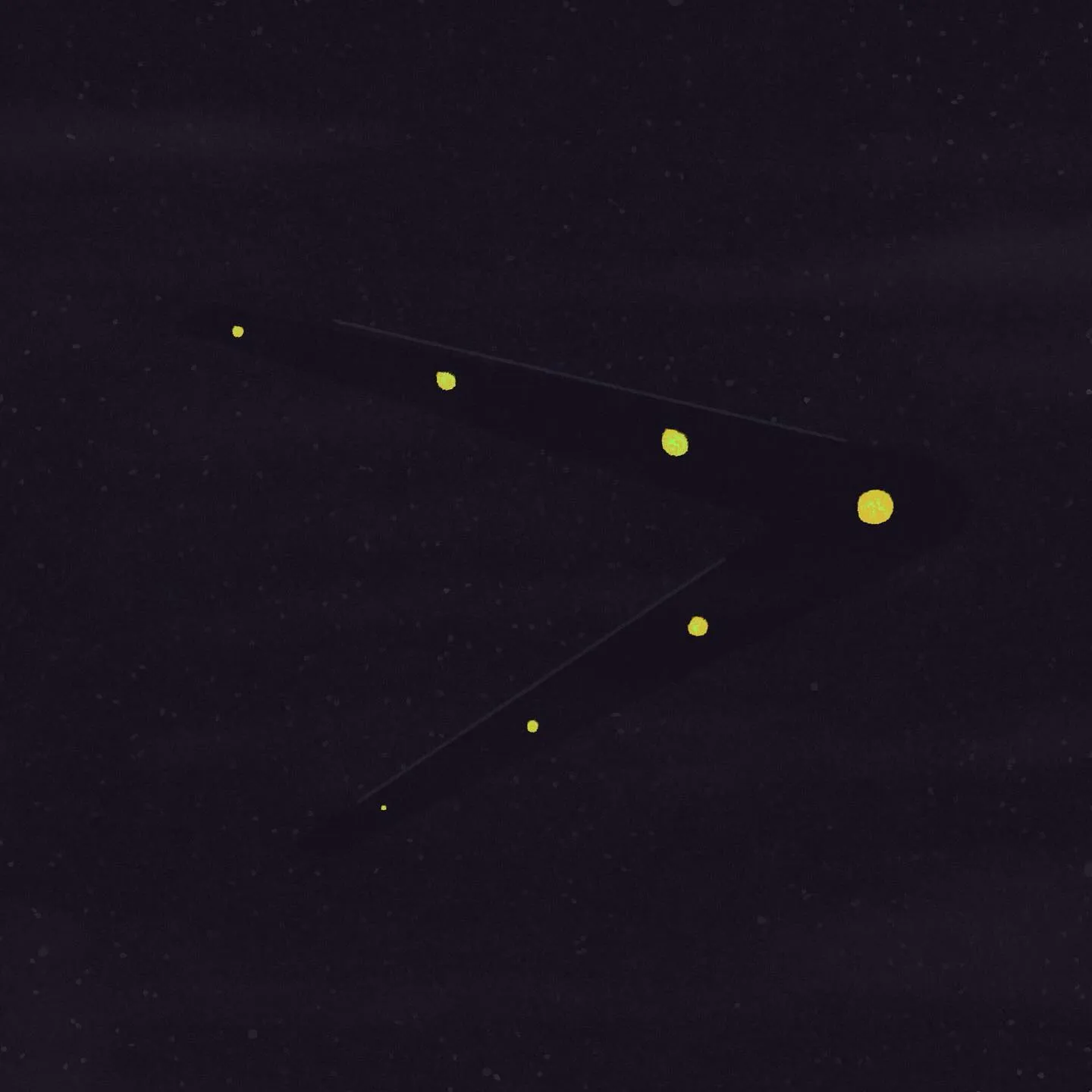 A dark background features two thin, angular yellow lines and a cluster of small, bright yellow dots arranged in a diagonal, chevron-like pattern.