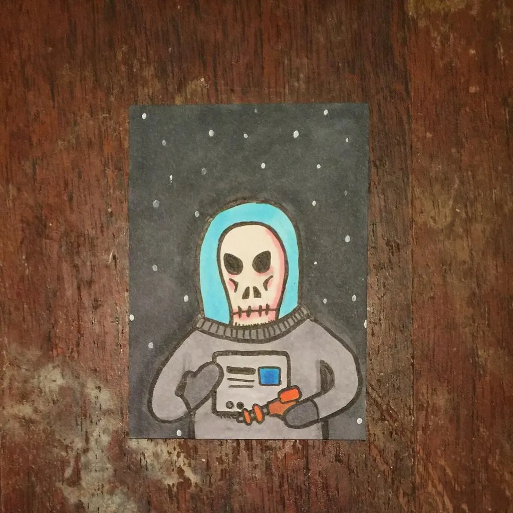 A stylized skull figure in a light blue hood and gray sweatshirt holds a small orange device against a dark gray background speckled with white dots.