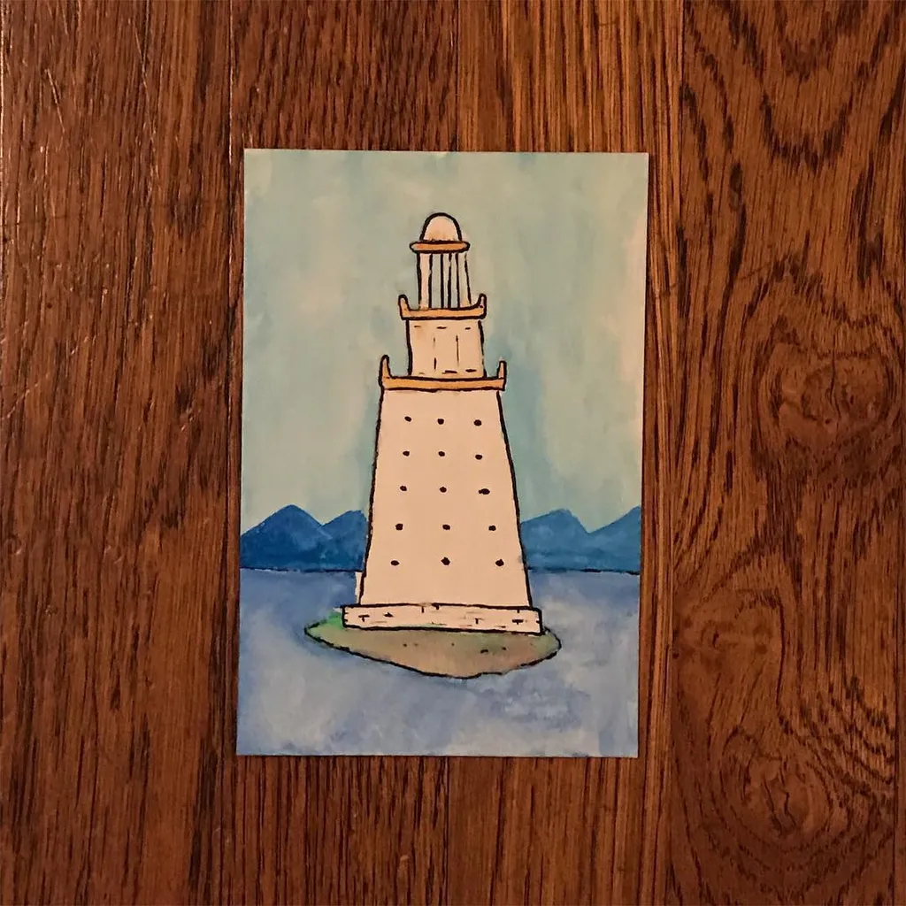 A lighthouse with a lantern room stands on a small patch of land in the center, surrounded by blue water and backed by dark blue mountains under a pale blue sky.