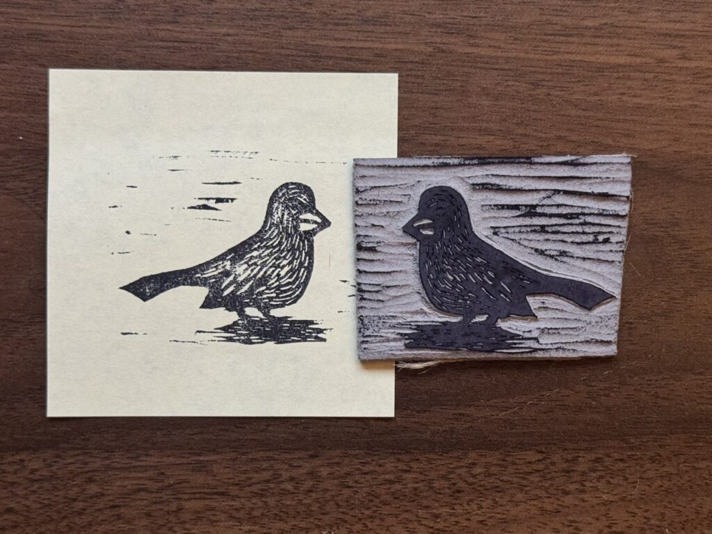 A stamp and its print of an Abert’s towhee. 