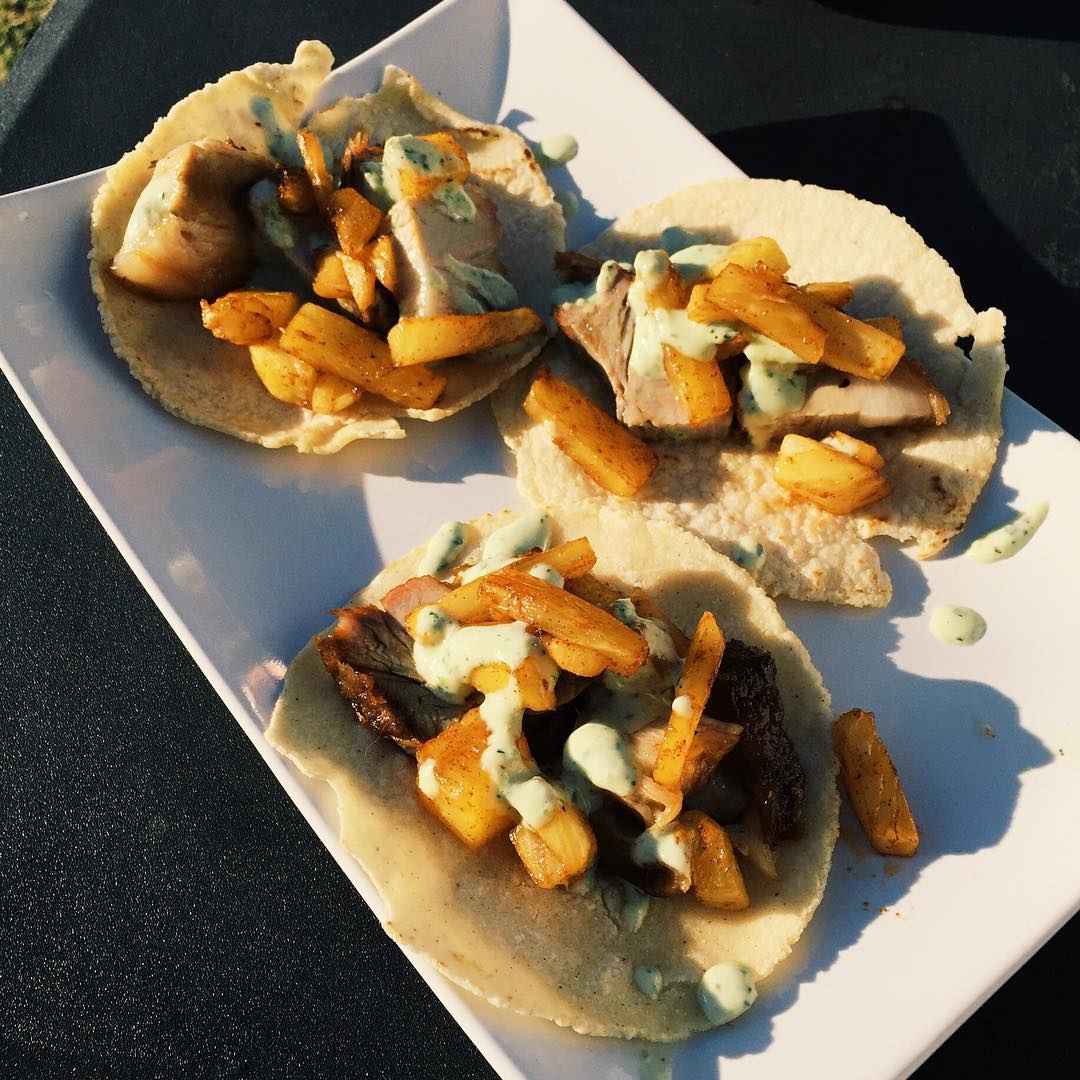 Pork belly tacos with chile roasted pineapple and a cilantro salsa on homemad…