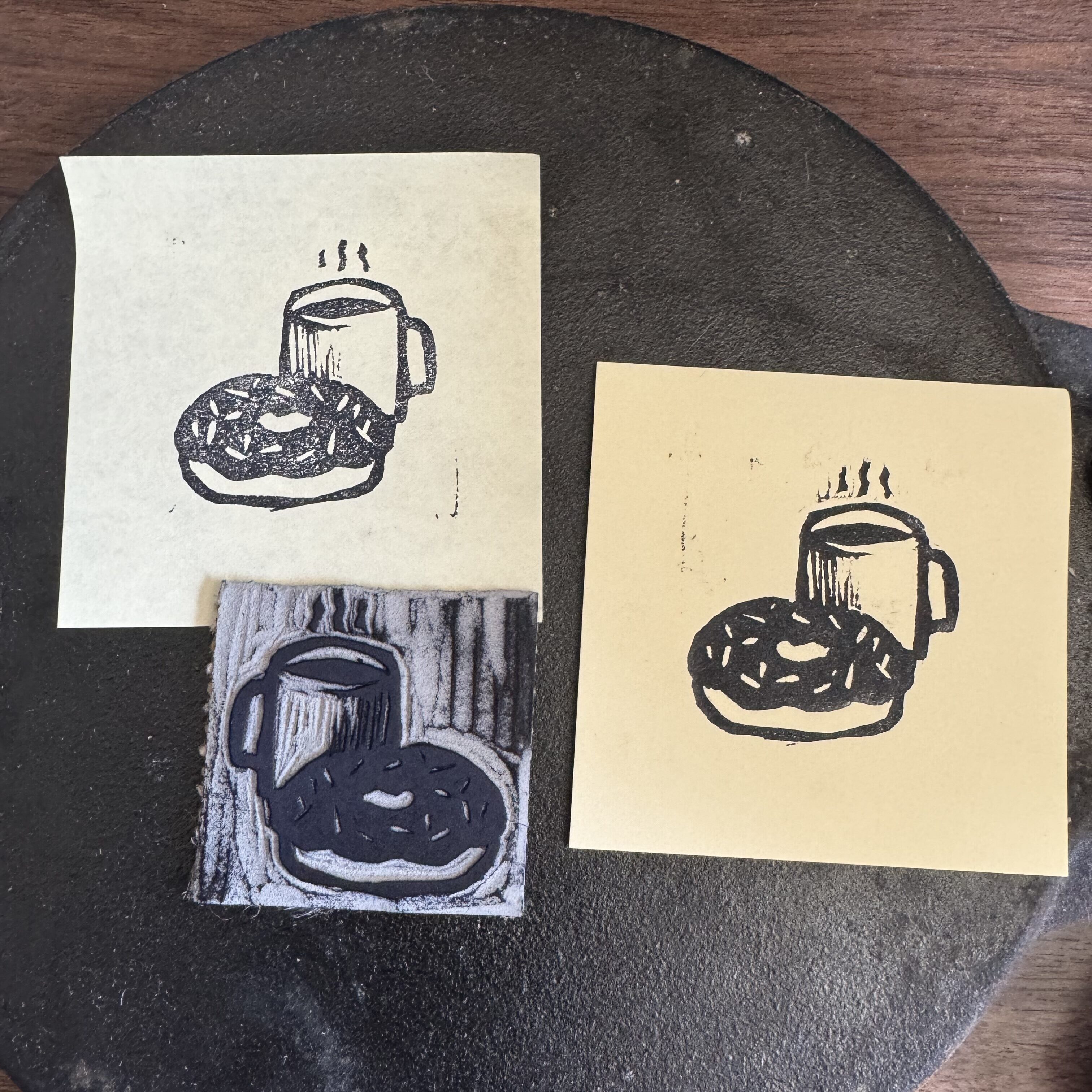 two post its on a tortilla press.